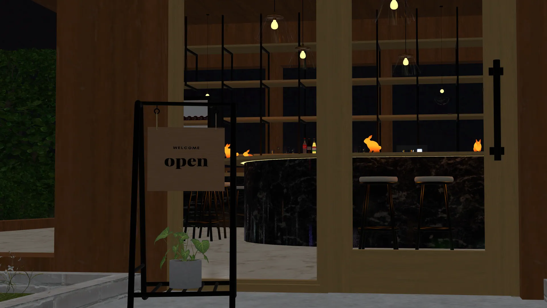 BAR SNOWのエントランス。ガラス越しにopenの立て看板とカウンターの灯り